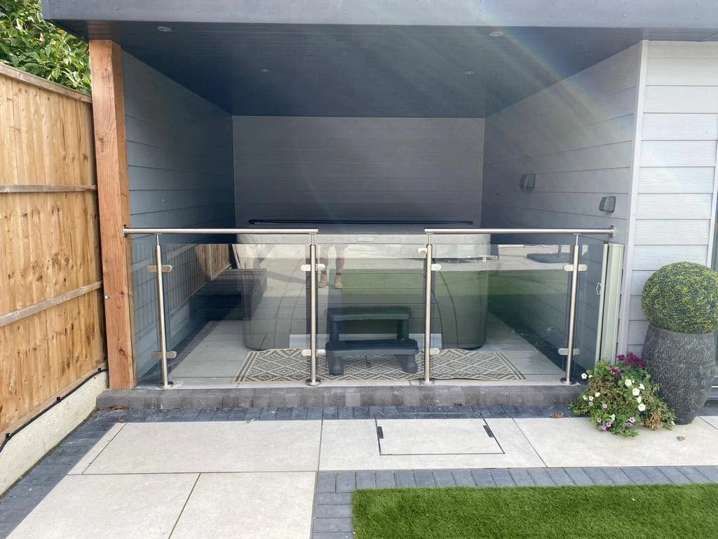Frameless outdoor glass balustrade at patio and garden room edge, Sevenoaks