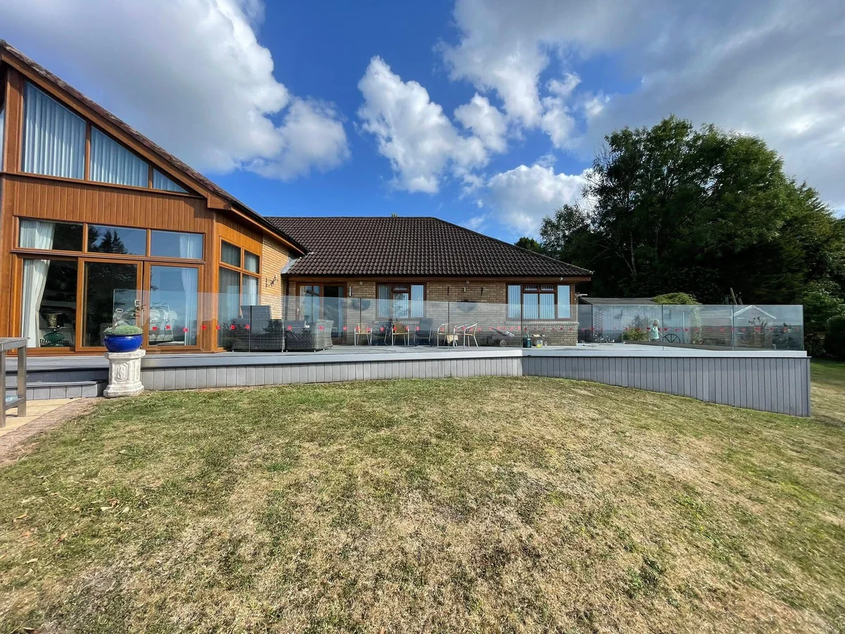 Frameless glass balustrade on garden terrace, Sevenoaks high-value property